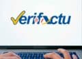 Logo de Verifactu en un portátil con manos tecleando: software de facturación que exigirá Hacienda desde 2025
