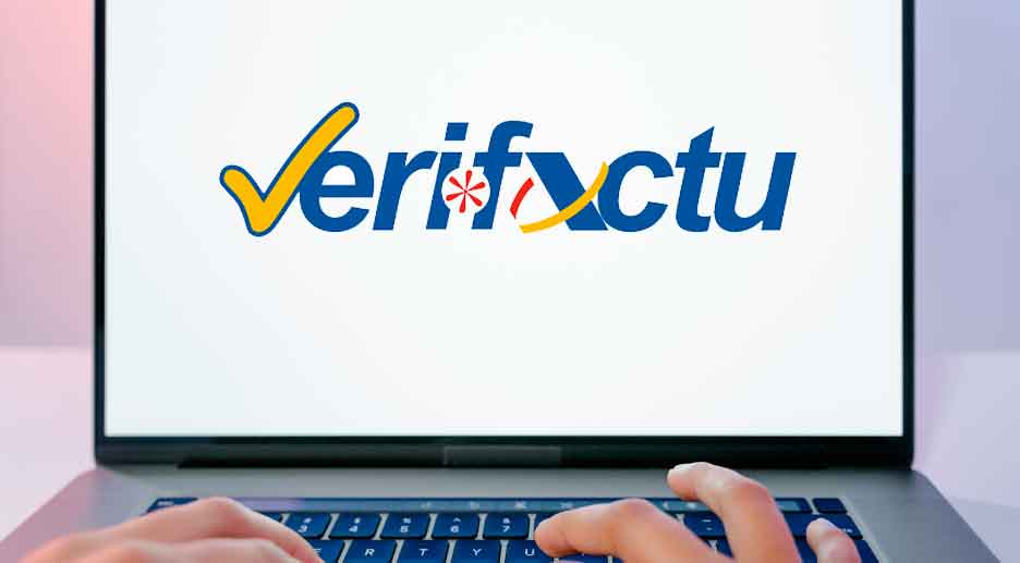 Logo de Verifactu en un portátil con manos tecleando: software de facturación que exigirá Hacienda desde 2025