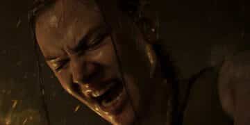 Abby gritando en una escena de The Last of Us Part II, mostrando una expresión de dolor o angustia.