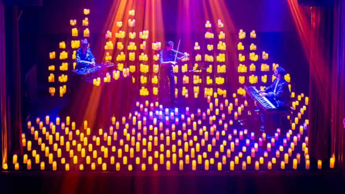 Concierto Candlelight Beats en Madrid con violinista, DJ y pianista rodeados de velas en Teatro Magno